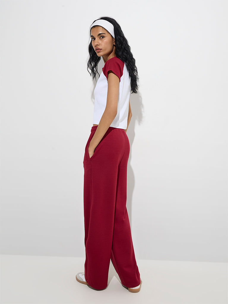 Westside Studiofit Women's Maroon Solid High-Rise Track Pants for Sports Wear Back View