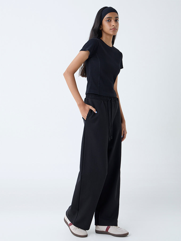 Westside Studiofit Women's Black Ribbed-Textured Cotton-Blend T-Shirt for Sports Wear Front View