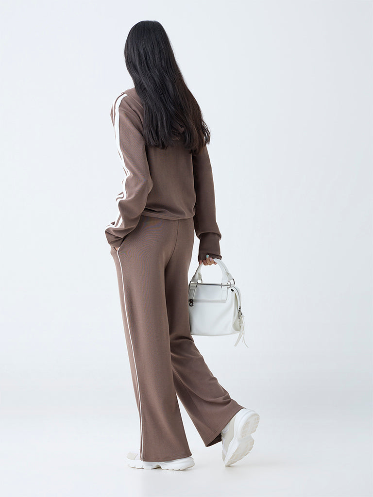 Westside Studiofit Women's Brown Solid High-Rise Track Pants for Sports Wear Back View