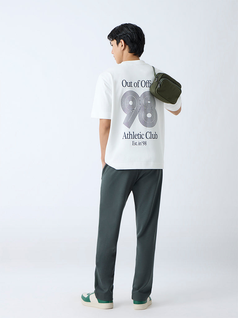 Westside Studiofit Men's Green Relaxed-Fit Mid-Rise Track Pants for Sports Wear Back View