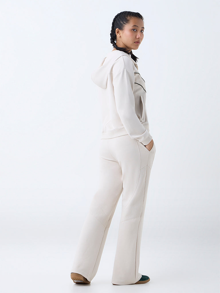 Westside Studiofit Women's Cream Ribbed High-Rise Track Pants for Sports Wear Back View