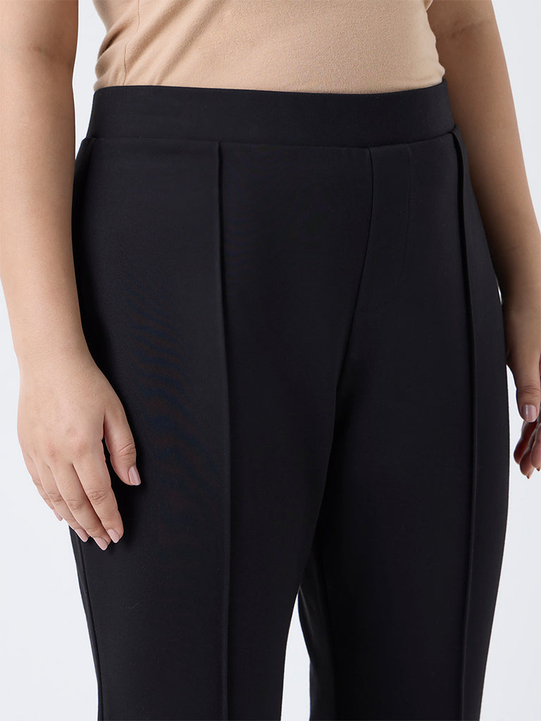 Buy Diza Black Solid Flared Pants from Westside
