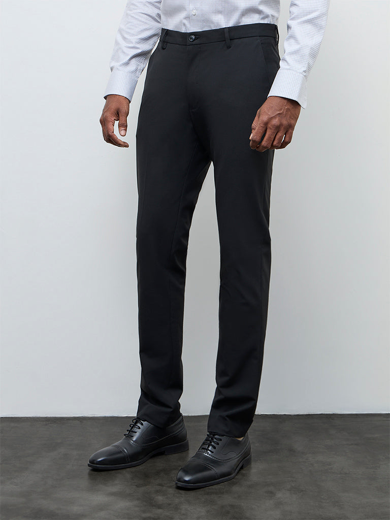 Buy WES Formals Black Solid Ultra Slim Fit Mid-Rise Trousers from Westside Buy WES Formals Black Solid Ultra Slim Fit Mid-Rise Trousers from Westside