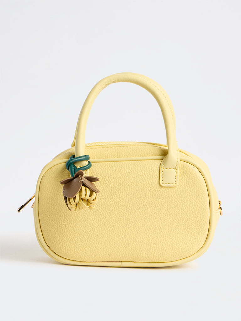 Westside Yellow Textured Sling Bag with a Floral Bag Charm
