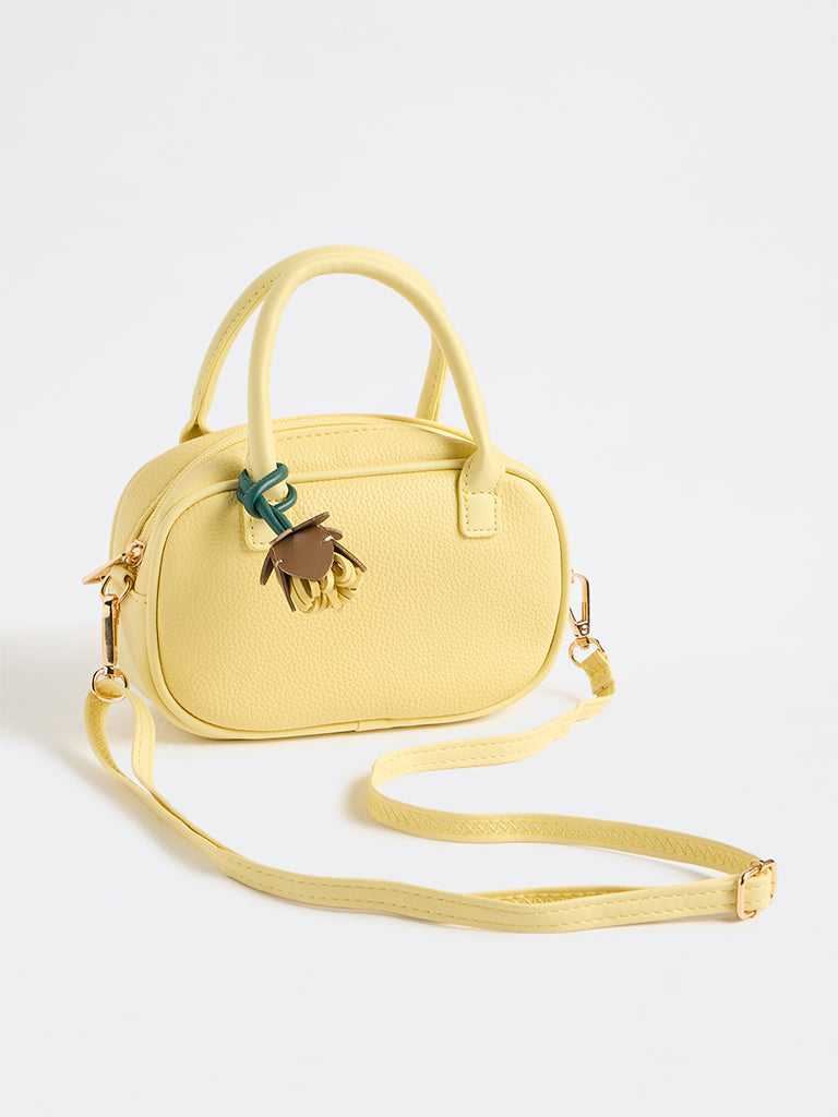 Westside Yellow Textured Sling Bag with a Floral Bag Charm