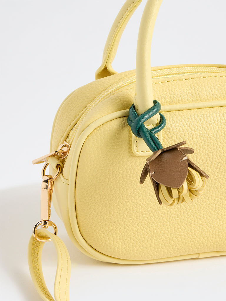 Westside Yellow Textured Sling Bag with a Floral Bag Charm