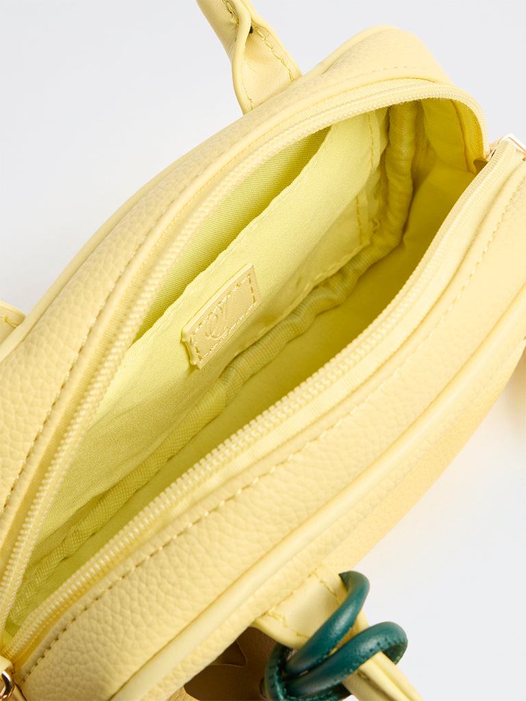 Westside Yellow Textured Sling Bag with a Floral Bag Charm