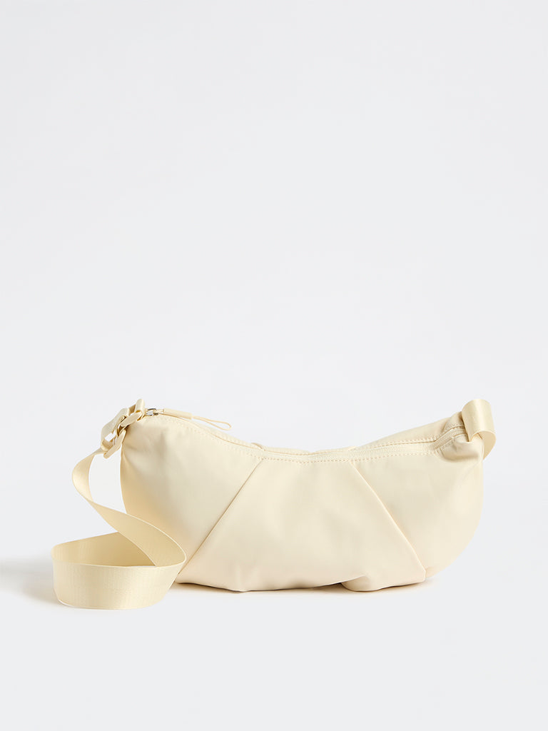 Westside Cream Croissant Sling Bag