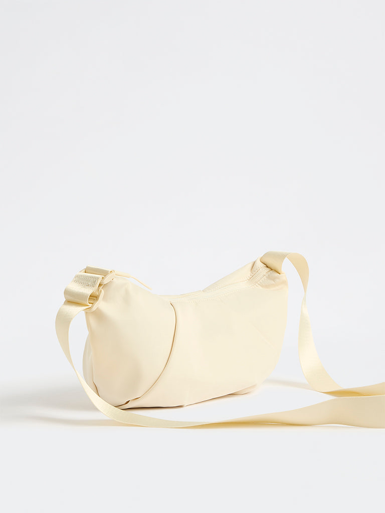 Westside Cream Croissant Sling Bag