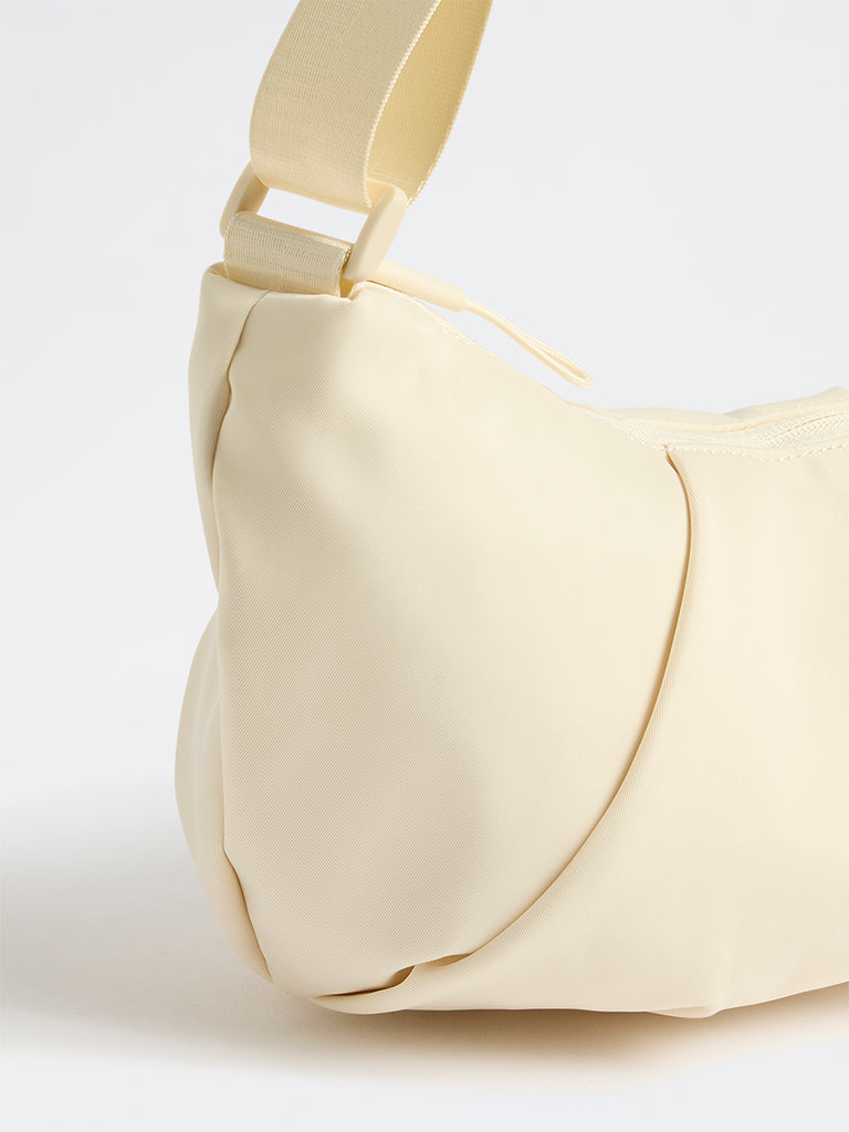 Westside Cream Croissant Sling Bag