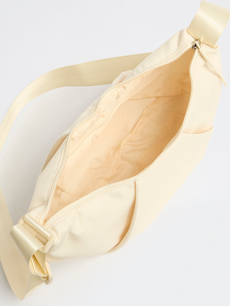 Westside Cream Croissant Sling Bag