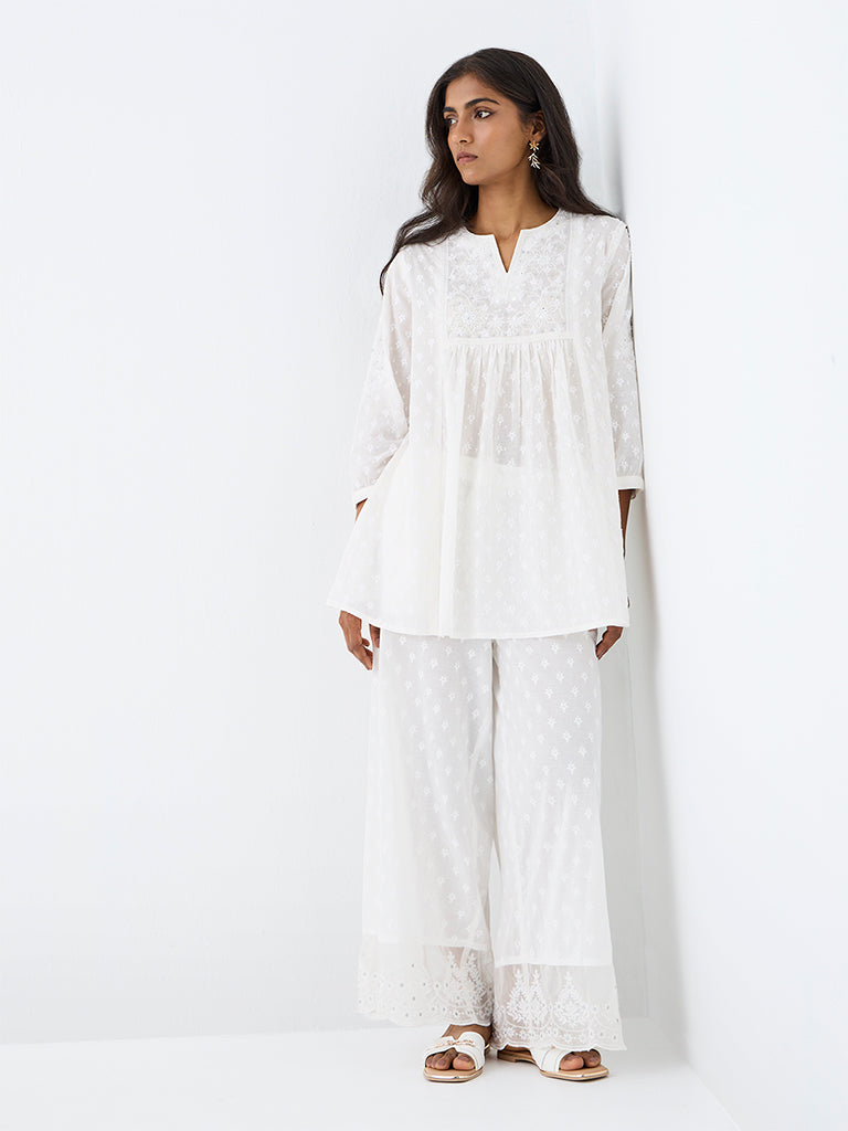Utsa White Floral Embroidered Cotton Kurti
