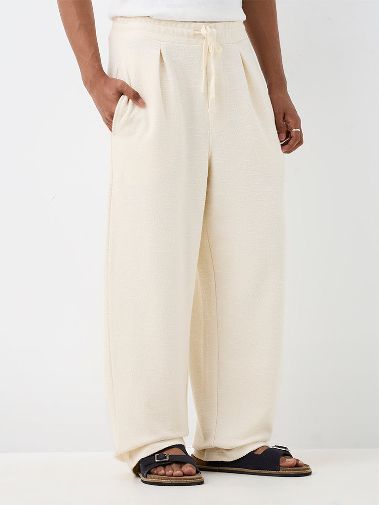ETA Off-White Textured Relaxed-Fit Mid-Rise Cotton-Blend Chinos