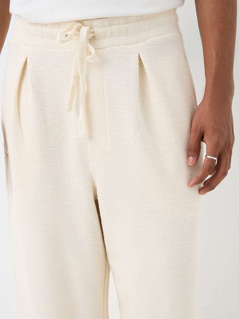 ETA Off-White Textured Relaxed-Fit Mid-Rise Cotton-Blend Chinos