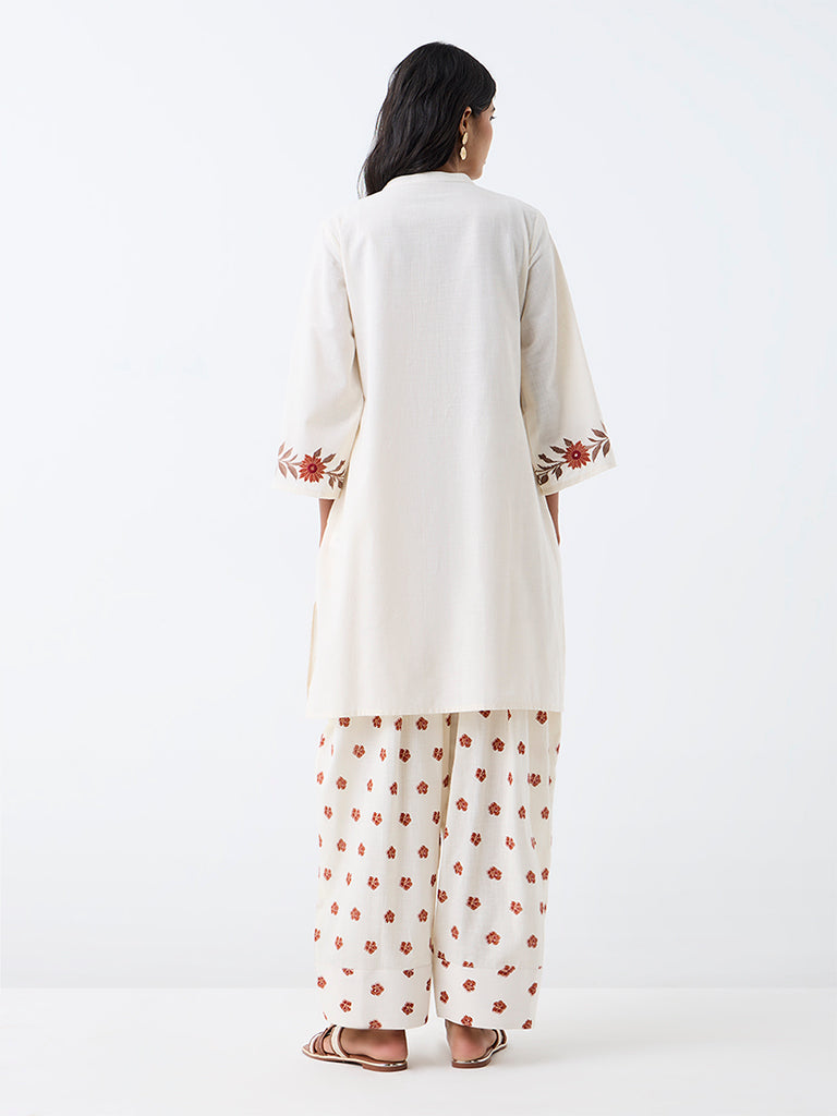 Utsa Off-White Floral Embroidered A-Line Kurta.