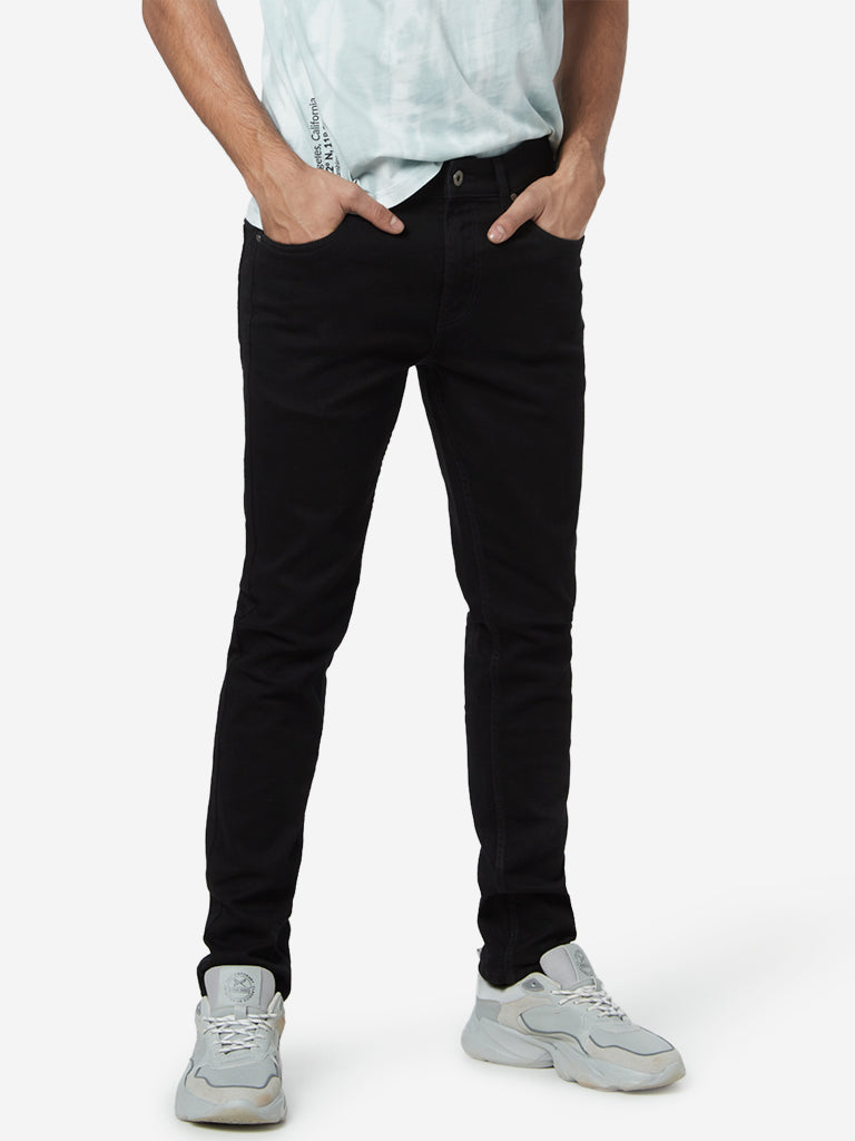 Nuon Black Nuo-Flex Hendrix Slim Fit Jeans | Black Slim Fit Jeans for men front view - Westside