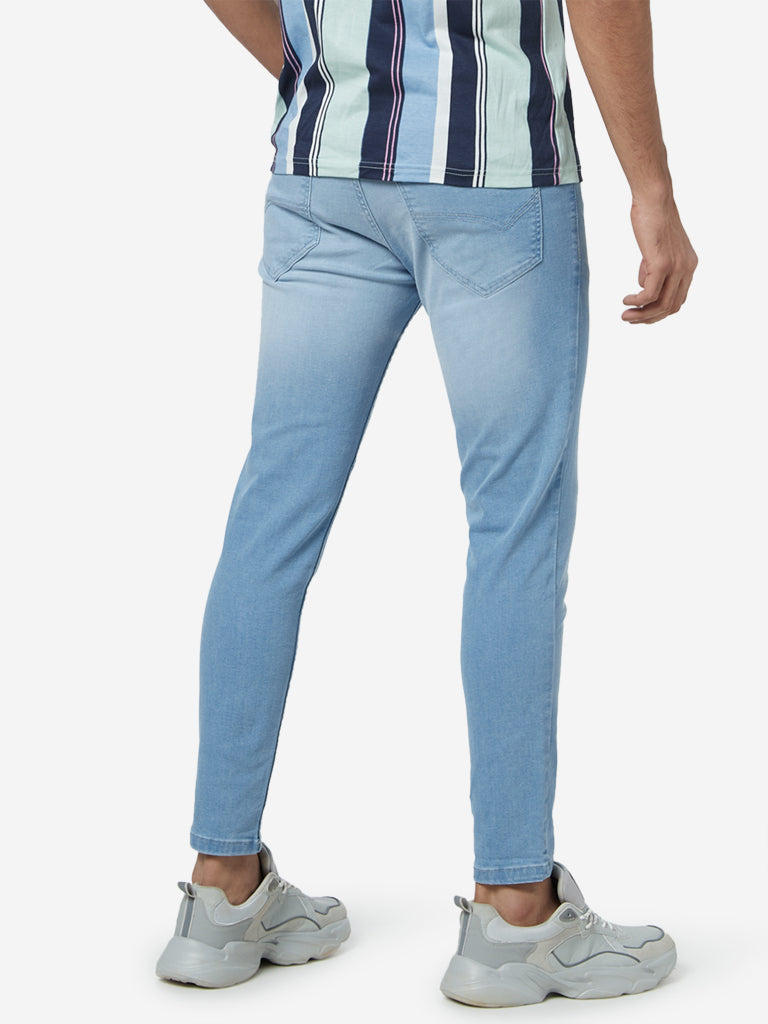 Nuon Light Blue Nuo-Flex Rodeo Carrot Fit Jeans | Light Blue Nuo-Flex Rodeo Carrot Fit Jeans for Men Back View - Westside