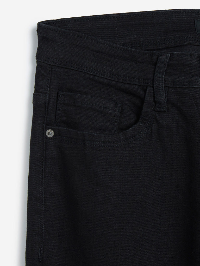 WES Casuals Black Relaxed Fit Jeans | Black Relaxed Fit Jeans for Men Close Up View - Westside