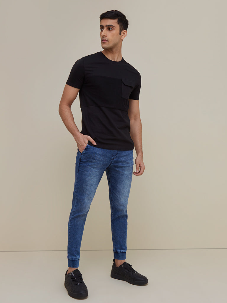Nuon Dark Blue Rodeo Carrot-Fit Joggers | Nuon Dark Blue Rodeo Carrot-Fit Joggers for Men Standing View - Westside